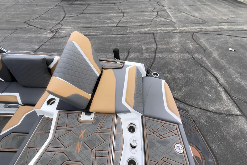 Slide: The Image of 2023 Tigé 23ZX boat interior with stylish gray and tan seating and deck design. - 39