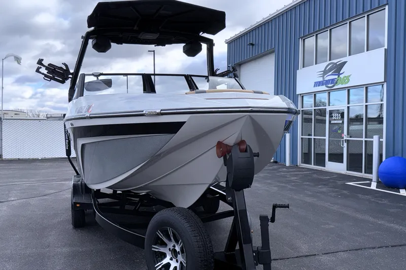 Slide: The Image of 2023 Tigé 23ZX boat on trailer outside Marine 365 showroom. - 4