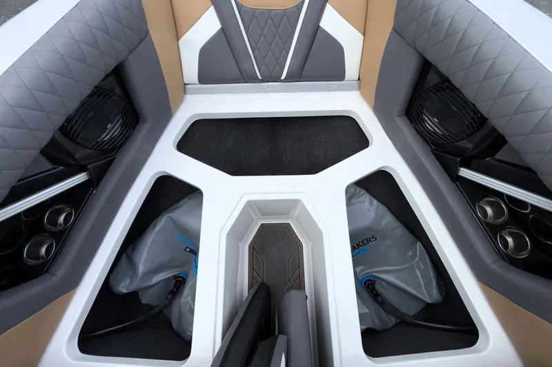 Slide: The Image of 2023 Tigé 23ZX boat interior with quilted seats and storage compartments. - 9