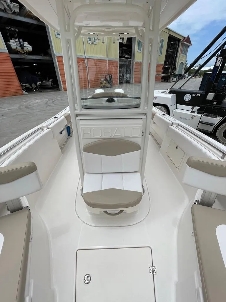 Slide: The Image of 2019 Robalo R242 Center Console boat interior with seating and storage compartments. - 18