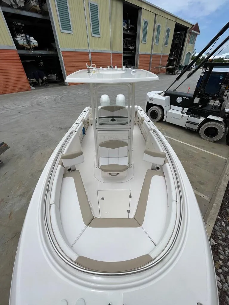 Slide: The Image of 2019 Robalo R242 Center Console boat docked at a marina. - 20