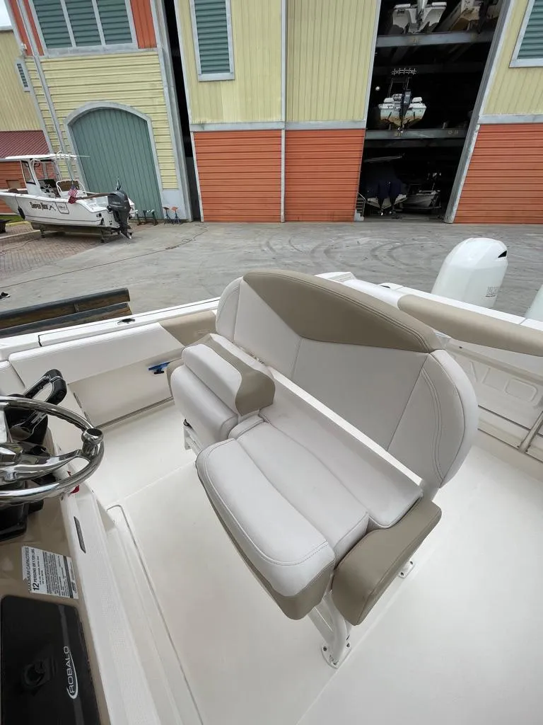 Slide: The Image of 2019 Robalo R242 Center Console boat interior with dual seating. - 22