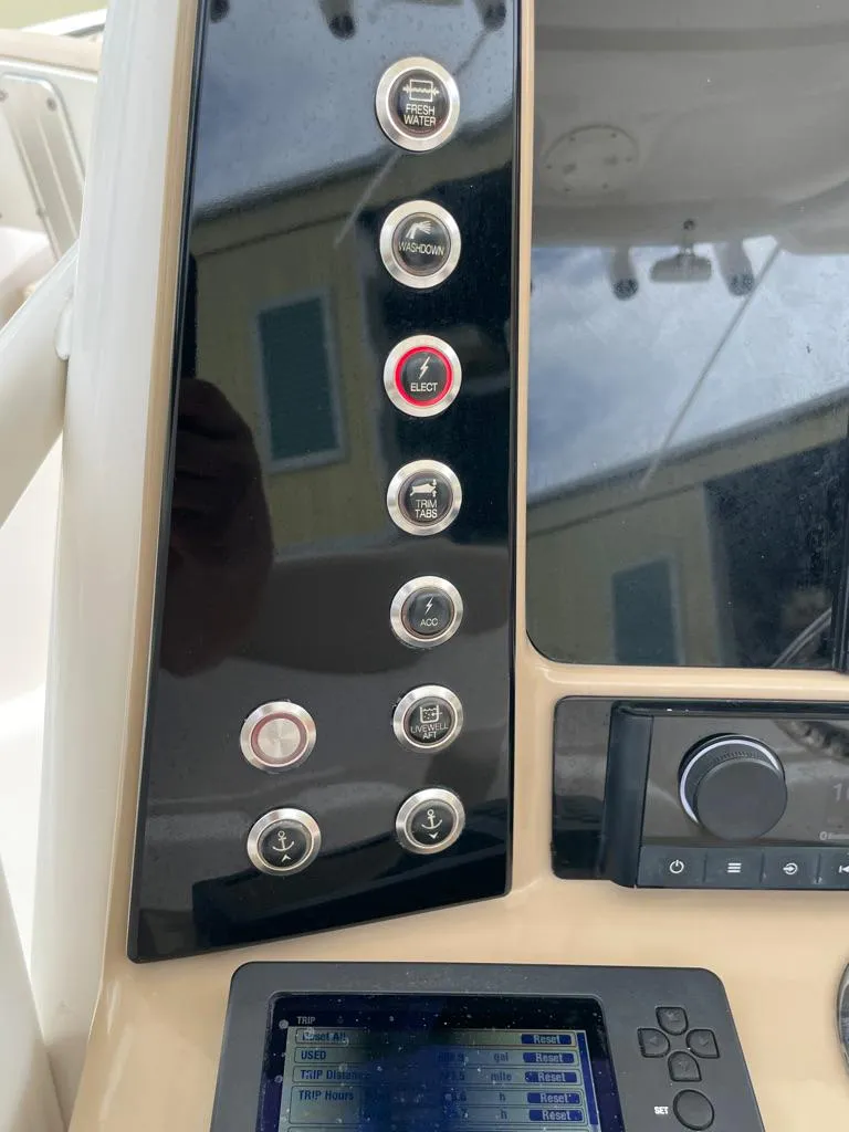 Slide: The Image of Control panel of a 2019 Robalo R242 Center Console boat. - 25