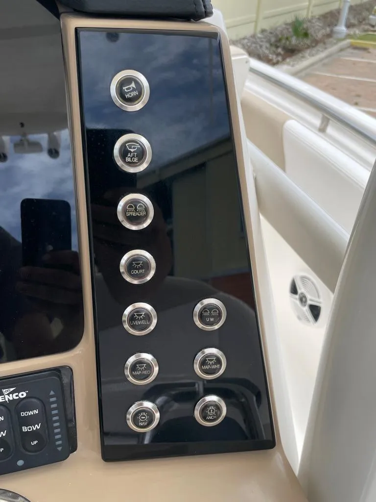 Slide: The Image of Control panel of a 2019 Robalo R242 Center Console boat. - 26