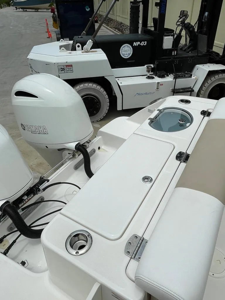 Slide: The Image of 2019 Robalo R242 Center Console boat with Yamaha outboard motor. - 9