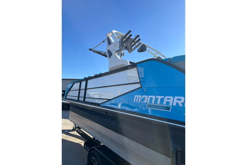 Slide: The Image of 2023 Montara 25 Surf Boss 2.0 CW boat with blue exterior and tower. - 3