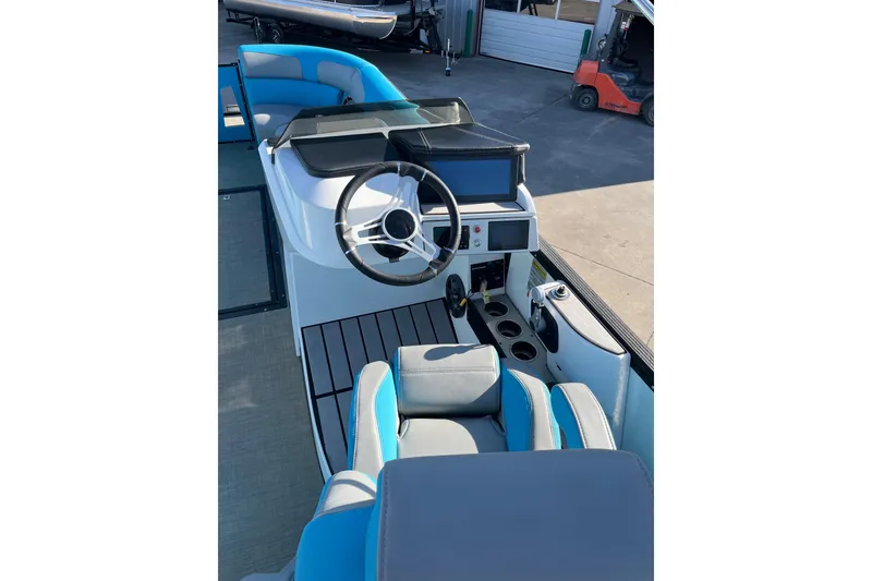 Slide: The Image of 2023 Montara 25 Surf Boss 2.0 CW boat interior with modern helm and seating. - 6