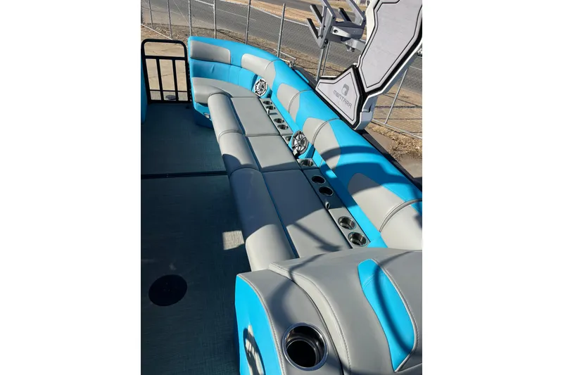 Slide: The Image of 2023 Montara 25 Surf Boss 2.0 CW boat interior with blue and gray seating. - 8