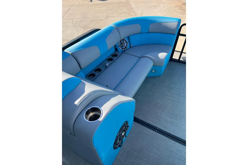 Slide: The Image of 2023 Montara 25 Surf Boss 2.0 CW boat interior with blue and gray seating. - 9