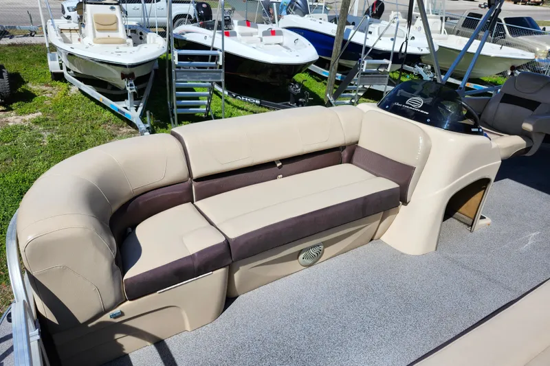 Slide: The Image of 2018 Sun Tracker Party Barge 20 DLX pontoon boat with beige seating and helm. - 11