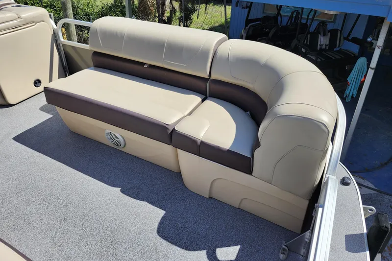 Slide: The Image of 2018 Sun Tracker Party Barge 20 DLX pontoon boat seating, beige and brown upholstery. - 12
