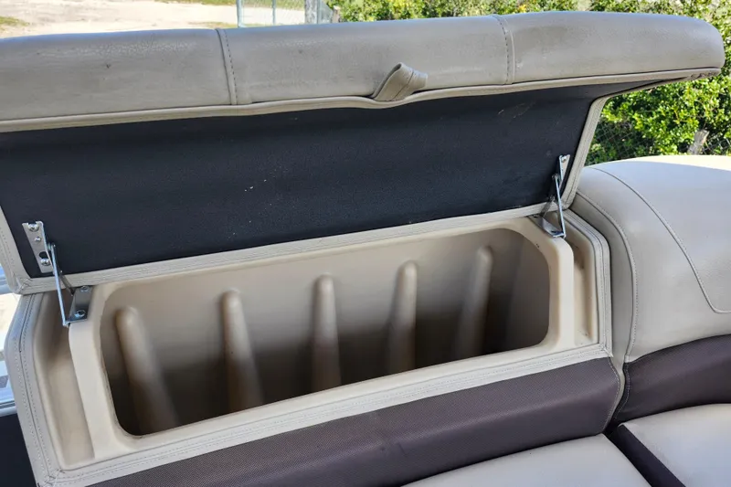 Slide: The Image of Open storage compartment on 2018 Sun Tracker Party Barge 20 DLX boat seat. - 24