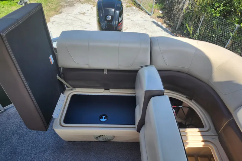 Slide: The Image of 2018 Sun Tracker Party Barge 20 DLX with open storage compartment and seating. - 26