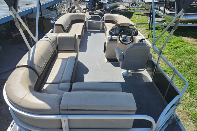 Slide: The Image of 2018 Sun Tracker Party Barge 20 DLX pontoon boat with spacious seating and steering console. - 28