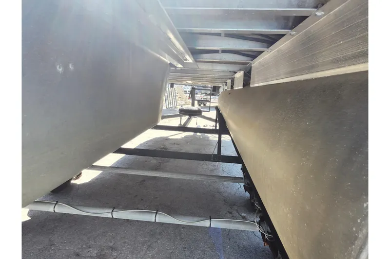 Slide: The Image of Underneath view of a 2018 Sun Tracker Party Barge 20 DLX pontoon boat. - 32