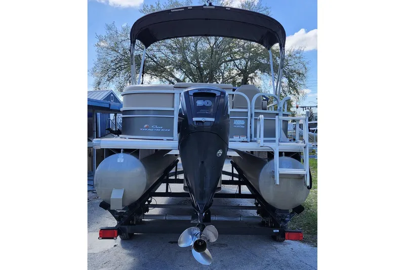 Slide: The Image of 2018 Sun Tracker Party Barge 20 DLX pontoon boat with outboard motor, rear view. - 5