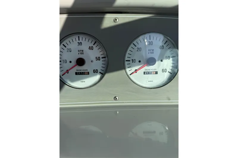 Slide: The Image of Dashboard gauges of a 2000 Formula 280 Bowrider boat showing RPM and engine hours. - 10