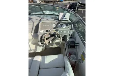 Slide: The Image of Interior of a 2000 Formula boat showing steering wheel and dashboard controls. - 5
