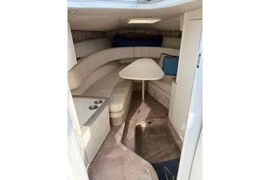 Slide: The Image of Interior of a 2000 Formula boat with seating and table. - 8