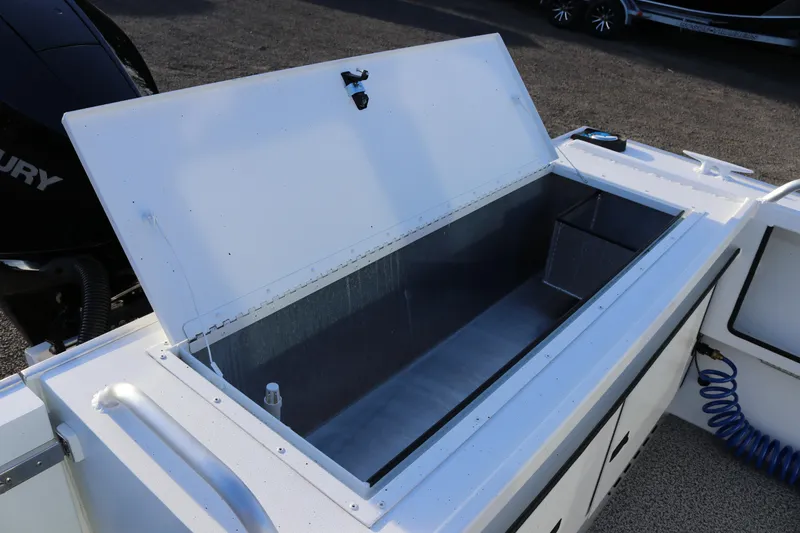 Slide: The Image of Open storage compartment on 2026 Alumaweld Intruder Outboard 22 boat. - 14