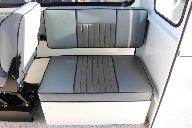 Slide: The Image of 2026 Alumaweld Intruder Outboard 22 interior seating with gray upholstery and modern design. - 25