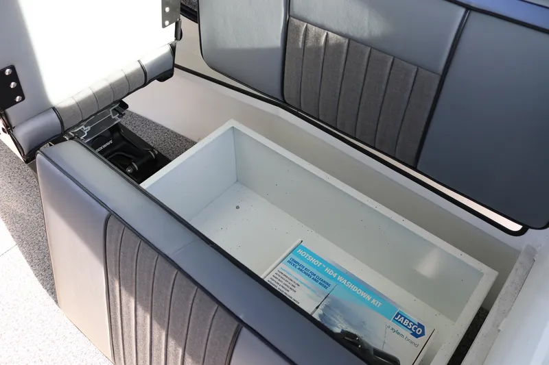 Slide: The Image of 2026 Alumaweld Intruder Outboard 22 boat storage compartment with Jabsco washdown kit. - 27