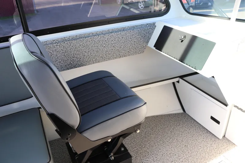 Slide: The Image of 2026 Alumaweld Intruder Outboard 22 interior with sleek seating and modern dashboard. - 30