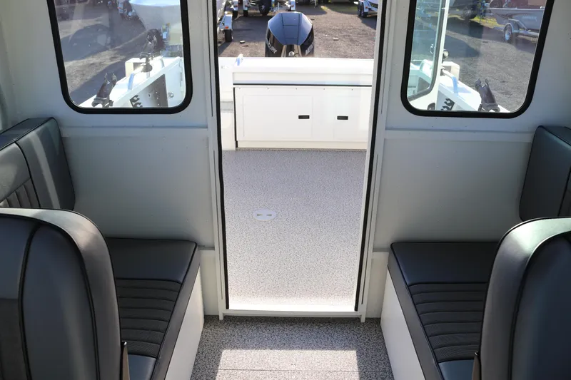 Slide: The Image of Interior view of 2026 Alumaweld Intruder Outboard 22 boat with seating and storage. - 33