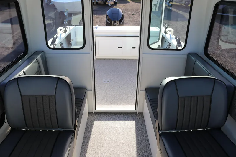 Slide: The Image of Interior of 2026 Alumaweld Intruder Outboard 22 boat with seating and storage. - 39