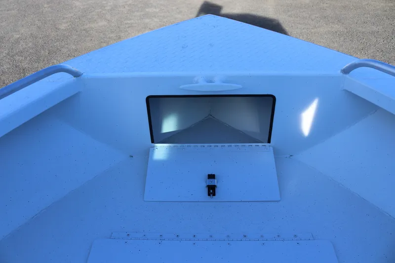 Slide: The Image of 2026 Alumaweld Intruder Outboard 22 boat interior, featuring storage compartment and sleek design. - 40