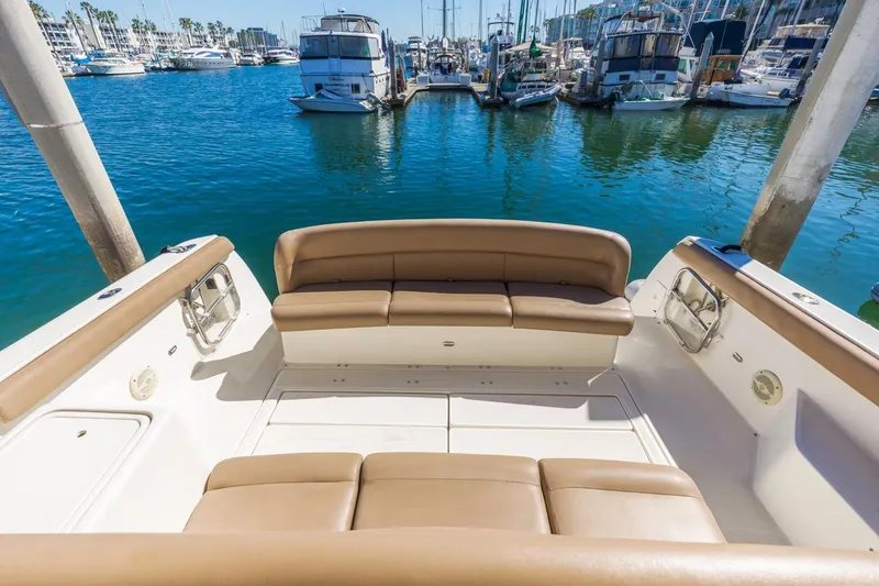 Slide: The Image of Tiara Yachts 4000 Express 2000 model, featuring spacious seating in a marina setting. - 11