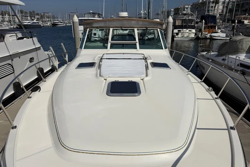 Slide: The Image of 2000 Tiara Yachts 4000 Express docked in a marina, showcasing its sleek design. - 18