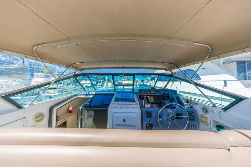 Slide: The Image of Cockpit view of 2000 Tiara Yachts 4000 Express, showcasing helm and controls. - 20