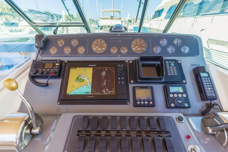 Slide: The Image of Control panel of a 2000 Tiara Yachts 4000 Express with navigation and communication equipment. - 22