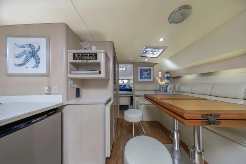 Slide: The Image of Interior of 2000 Tiara Yachts 4000 Express, featuring modern seating and decor. - 26