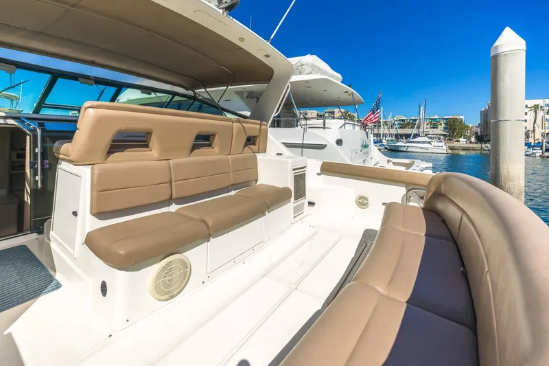 Slide: The Image of Luxurious 2000 Tiara Yachts 4000 Express with spacious seating at marina. - 9
