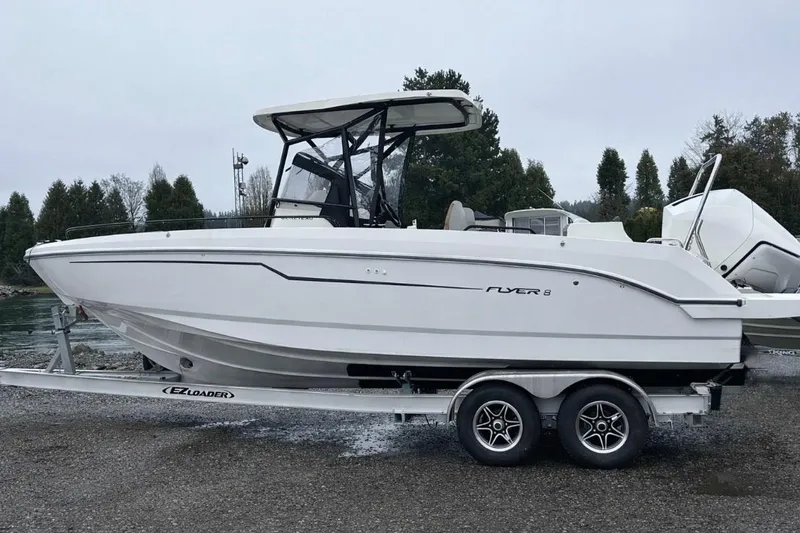 Slide: The Image of 2024 Beneteau Flyer 8 SPACEdeck boat on trailer, side view, outdoors. - 3