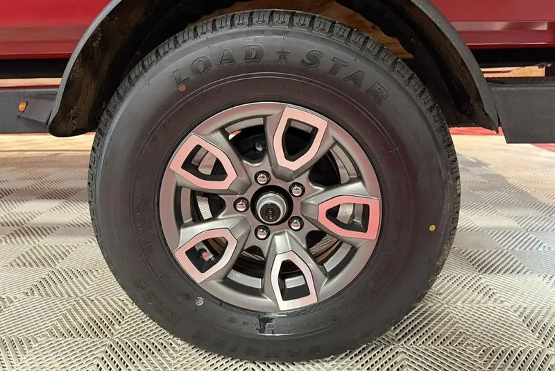 Slide: The Image of 2026 Tracker Pro Team 195 Tournament Edition wheel with Load Star tire on display. - 10