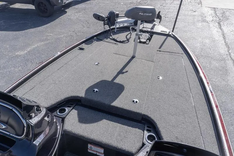 Slide: The Image of 2019 Nitro Z20 Pro boat deck with trolling motor and carpeted surface. - 11