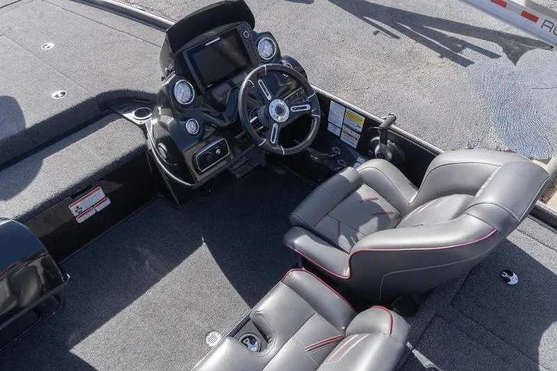 Slide: The Image of 2019 Nitro Z20 Pro boat interior with steering console and cushioned seats. - 17