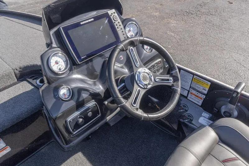 Slide: The Image of Steering console of a 2019 Nitro Z20 Pro boat with navigation display. - 18