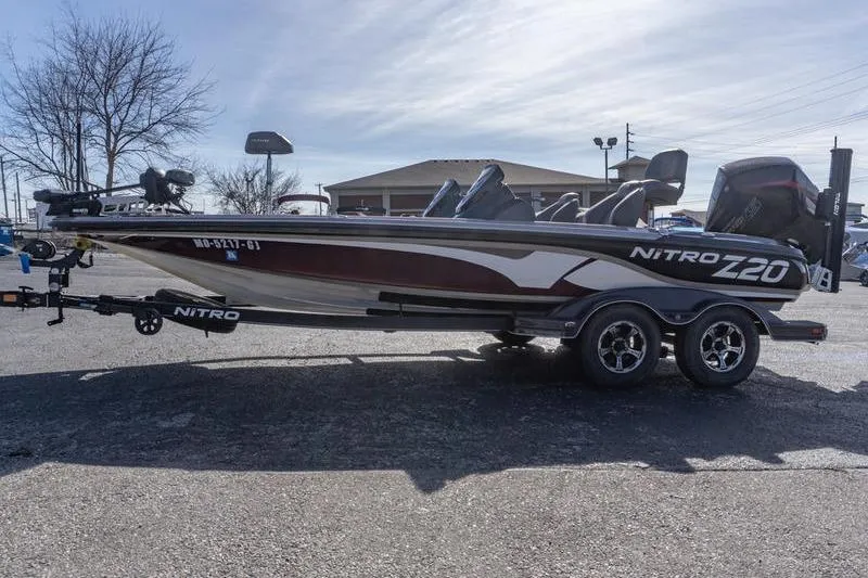 Slide: The Image of 2019 Nitro Z20 Pro fishing boat on trailer, parked outdoors. - 3