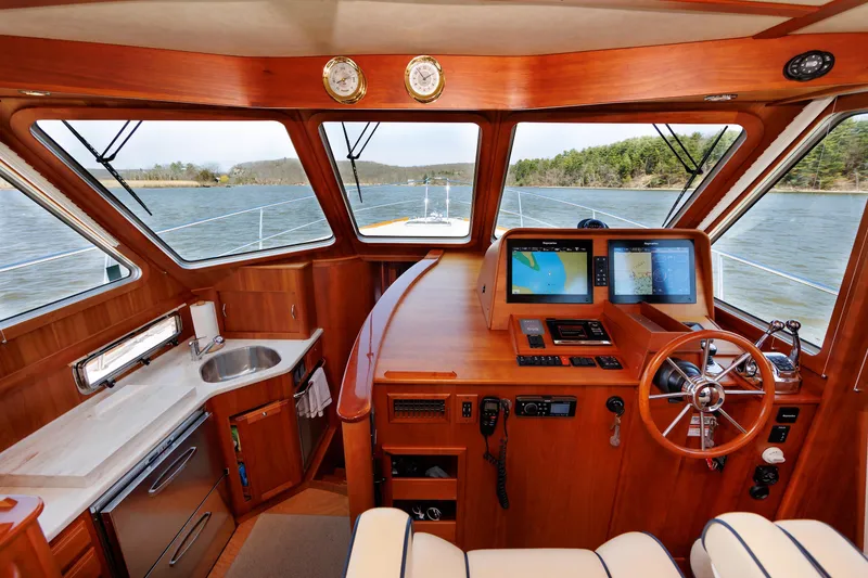 Slide: The Image of Interior view of 2016 Sabre 42 Fly Bridge Sedan helm with navigation equipment. - 10