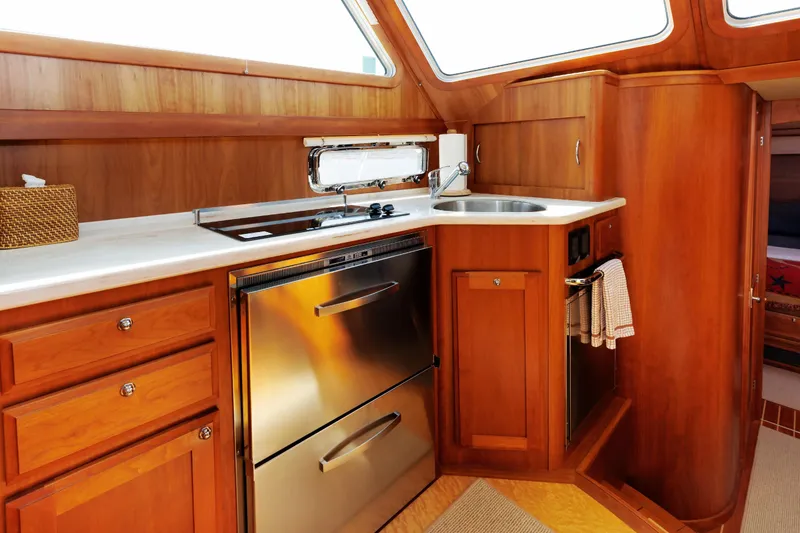 Slide: The Image of Luxurious wooden interior of 2016 Sabre 42 Fly Bridge Sedan yacht kitchen. - 11