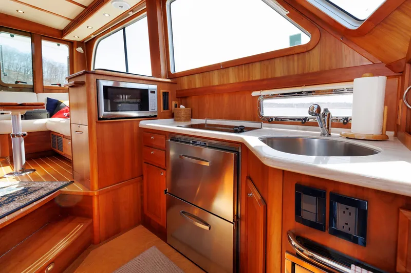 Slide: The Image of Luxurious interior of 2016 Sabre 42 Fly Bridge Sedan yacht kitchen area. - 12
