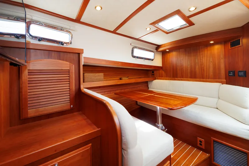Slide: The Image of Luxurious interior of 2016 Sabre 42 Fly Bridge Sedan with wood finish and plush seating. - 14