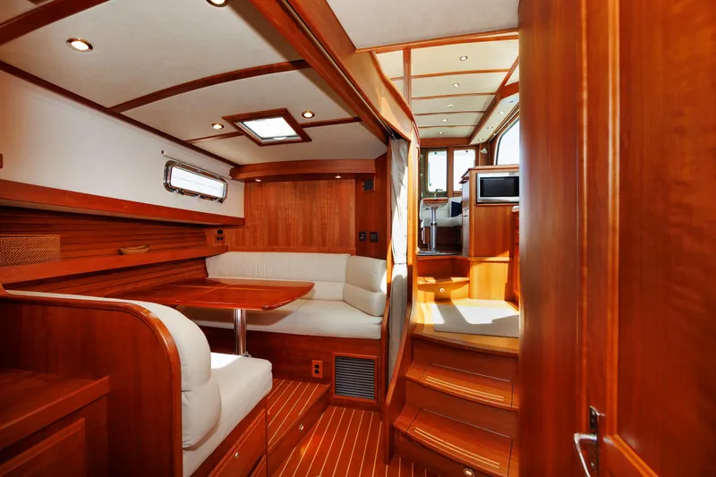 Slide: The Image of Luxurious interior of 2016 Sabre 42 Fly Bridge Sedan yacht with wood finish and seating area. - 2