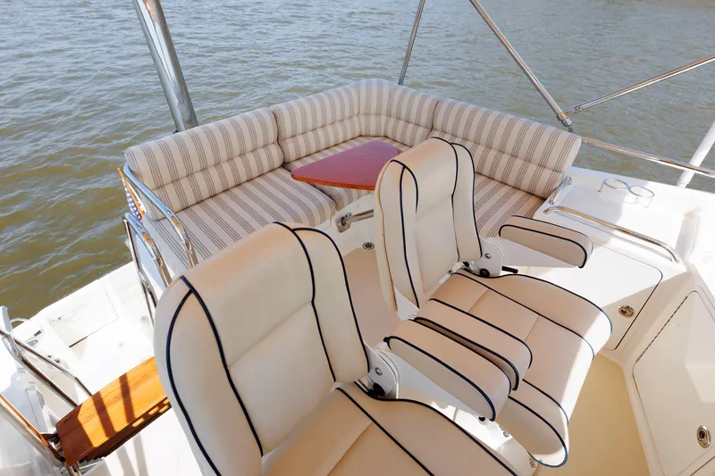 Slide: The Image of 2016 Sabre 42 Fly Bridge Sedan with cushioned seating and water view. - 25