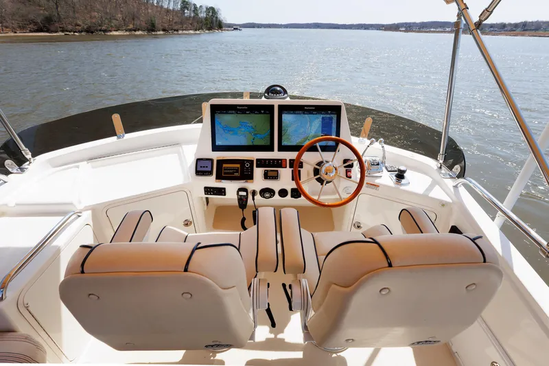 Slide: The Image of Flybridge helm of 2016 Sabre 42 Fly Bridge Sedan with dual screens and leather seats. - 28