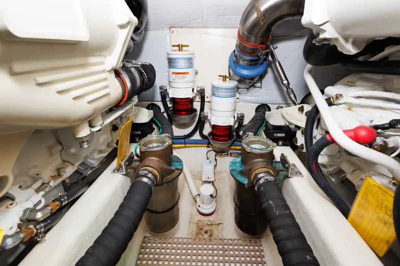 Slide: The Image of Engine room of 2016 Sabre 42 Fly Bridge Sedan with visible components and filters. - 33